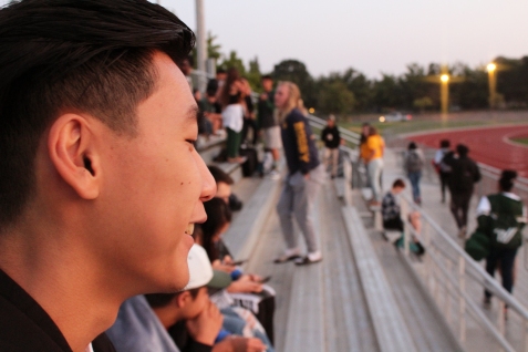 Enjoying the sunrise, Nelson Poon (12) spends time with his friends. Seniors gathered to watch the sun rise over their final year in high school on the morning of September 8, 2017. (Photo by Bruce Tran)